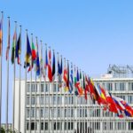 A row of flags of different nationalities.