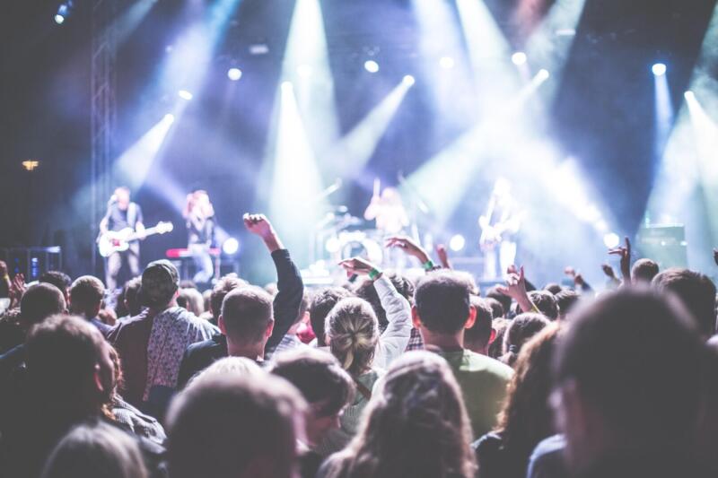 Concert crowd cheering.