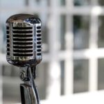 A microphone in a sound stage to represent using tone of voice.