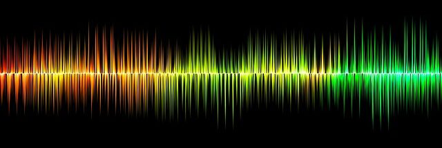 A colorful soundwave on a black background.
