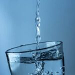 Water being poured into a glass.