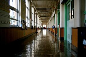 High school hallway with windows.