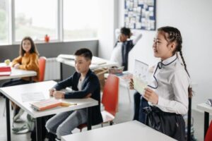 Students in a classroom engaging during a presentation, emphasizing education and learning.