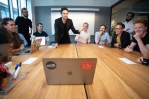 Round table discussion meeting with a diverse group of business people.