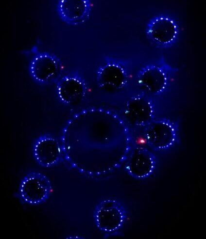 A futuristic space-themed background featuring glowing circles styled as crystal batteries.