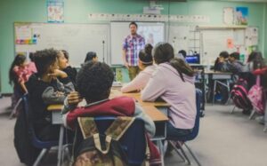 Teacher in a high school classroom.