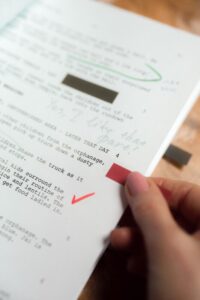 Open script book with highlighted character lines and narration notes for voice acting prep.