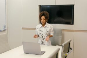 Professional presenting a live webinar from a clean workspace with good lighting.