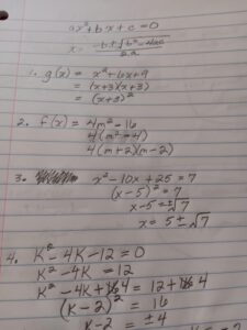 Algebra study notebook displaying factored quadratic equations and linear graph notes.