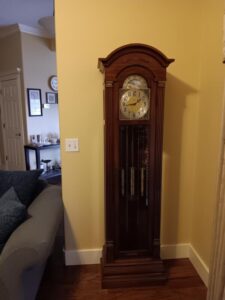 An antique grandfather clock in a beautiful parlor.