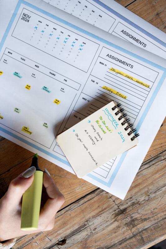 A clean desk with organized planner and notebook.